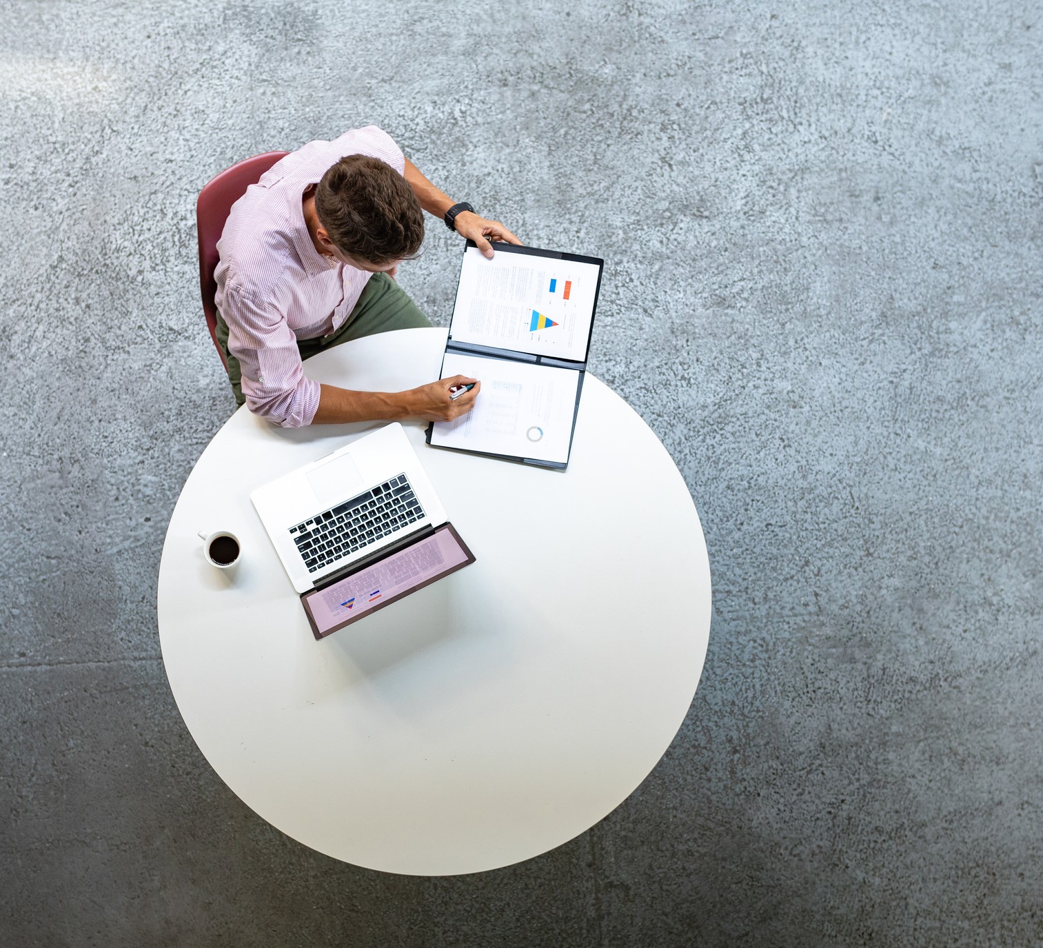 Overhead Photo of Businessman Working at a Round Table
