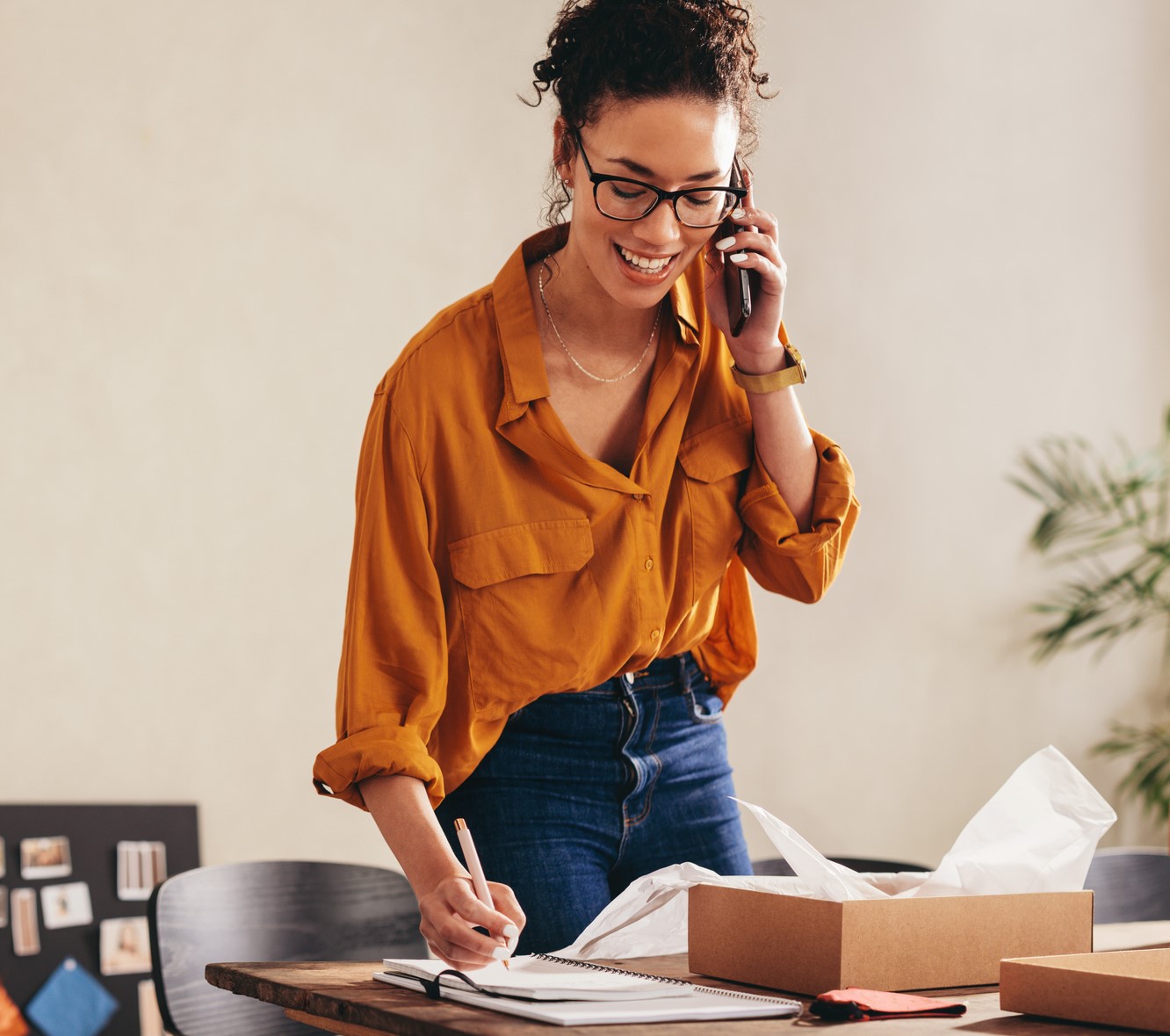Drop shipping business owner confirming the order on phone